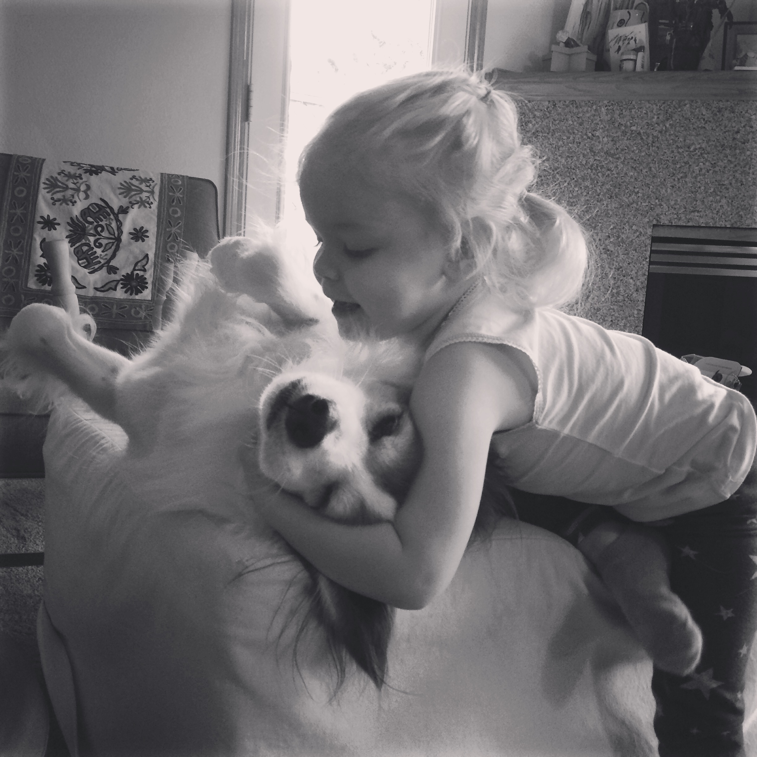 preschooler and dog hug