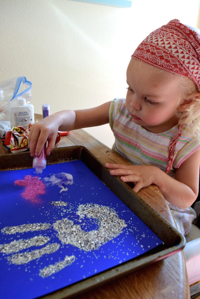 This glitter handprint craft is fun for kids to make - and perfect for a Christmas gift! Ten Thousand Hour Mama