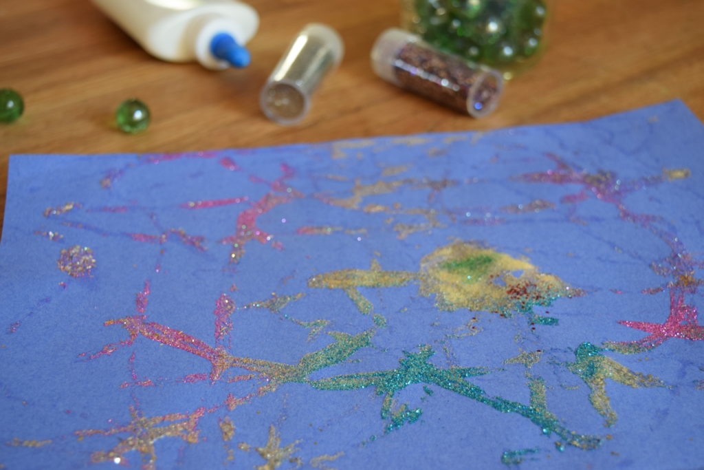 My kids love glitter and glue crafts, so voila: Glitter Marble Painting process art! Ten Thousand Hour Mama