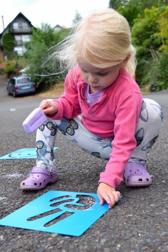 Chalk stencils are a ton of fun for outdoor kids play! Ten Thousand Hour Mama