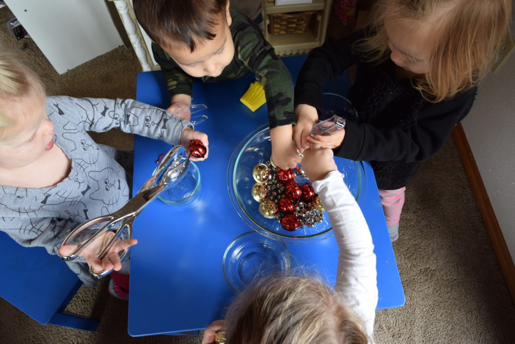 Sounds theme and activities for homeschool preschool: Jingle bell fine motor sorting. Ten Thousand Hour Mama