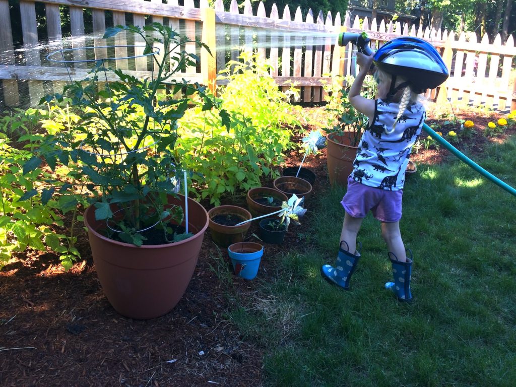 Kids learn responsibility by doing chores like gardening—plus 11 more reasons why you should garden with your kids. Ten Thousand Hour Mama